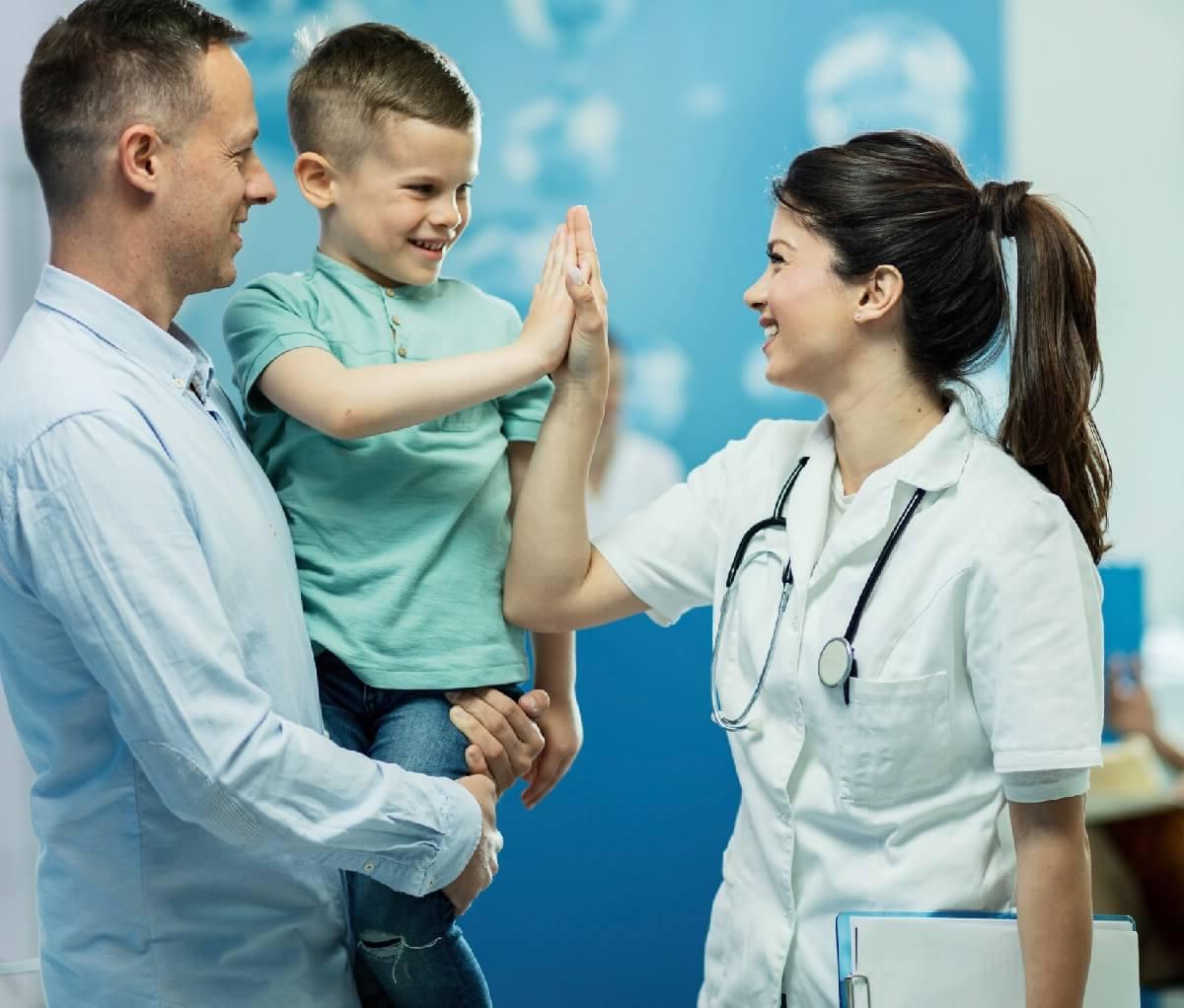 APRN with Post Master's Certificate High Fiving Child Patient